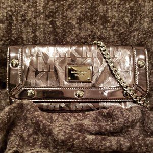 SOLD. Michael Kors Signature Stud Silver Clutch